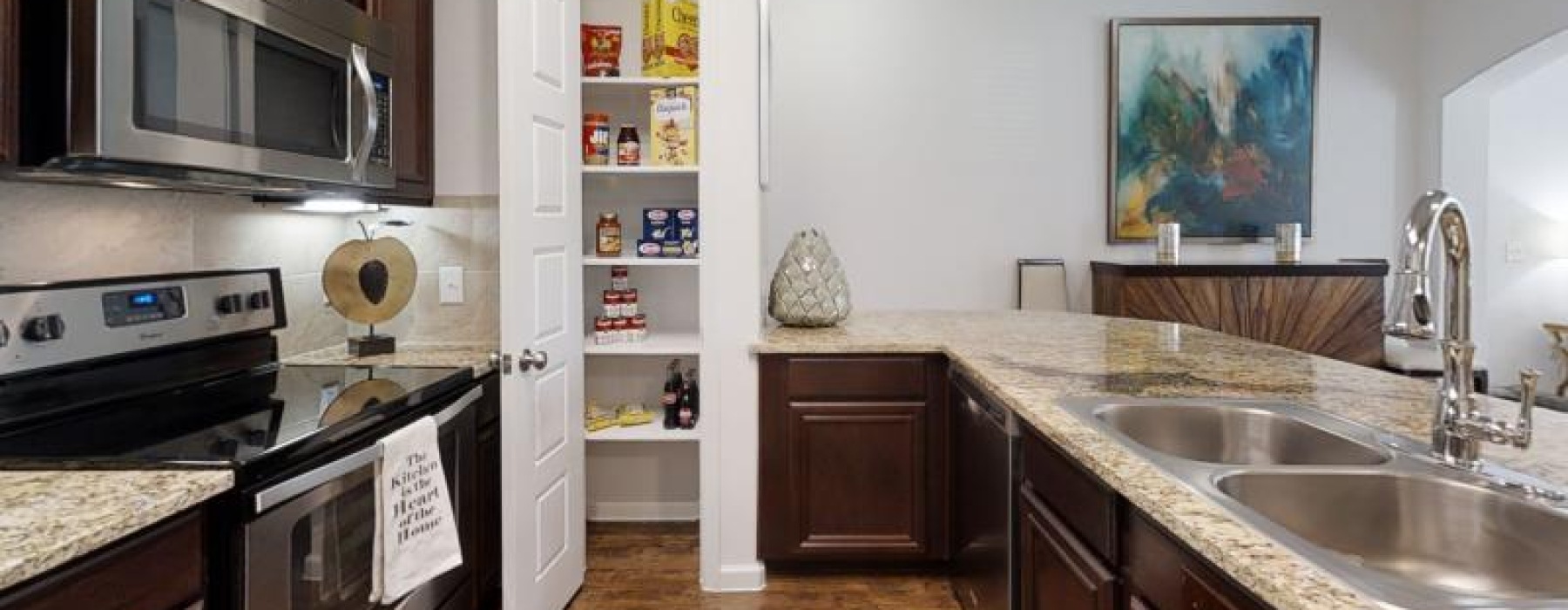a kitchen with a stove and oven