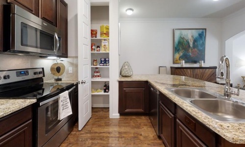 a kitchen with a stove and oven