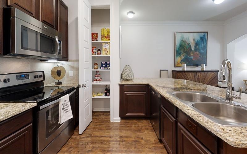 a kitchen with a stove and oven