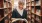 a woman reading a book in a library