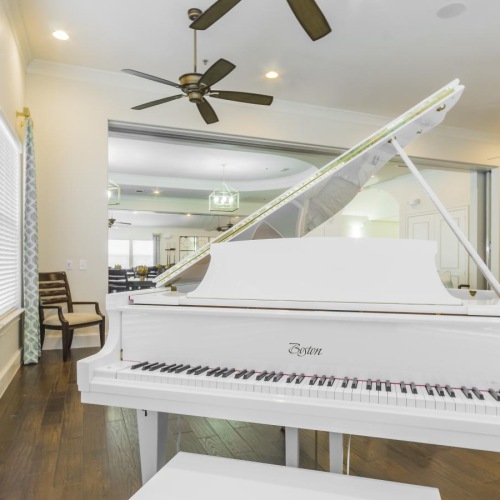 a white piano in a room